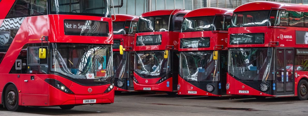 Row of London buses at a station