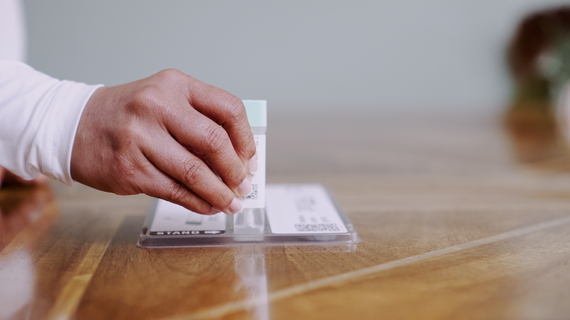 Image shows open FIT aid kit from the side. A hand is holding the bottle and dip stick up to show the camera.